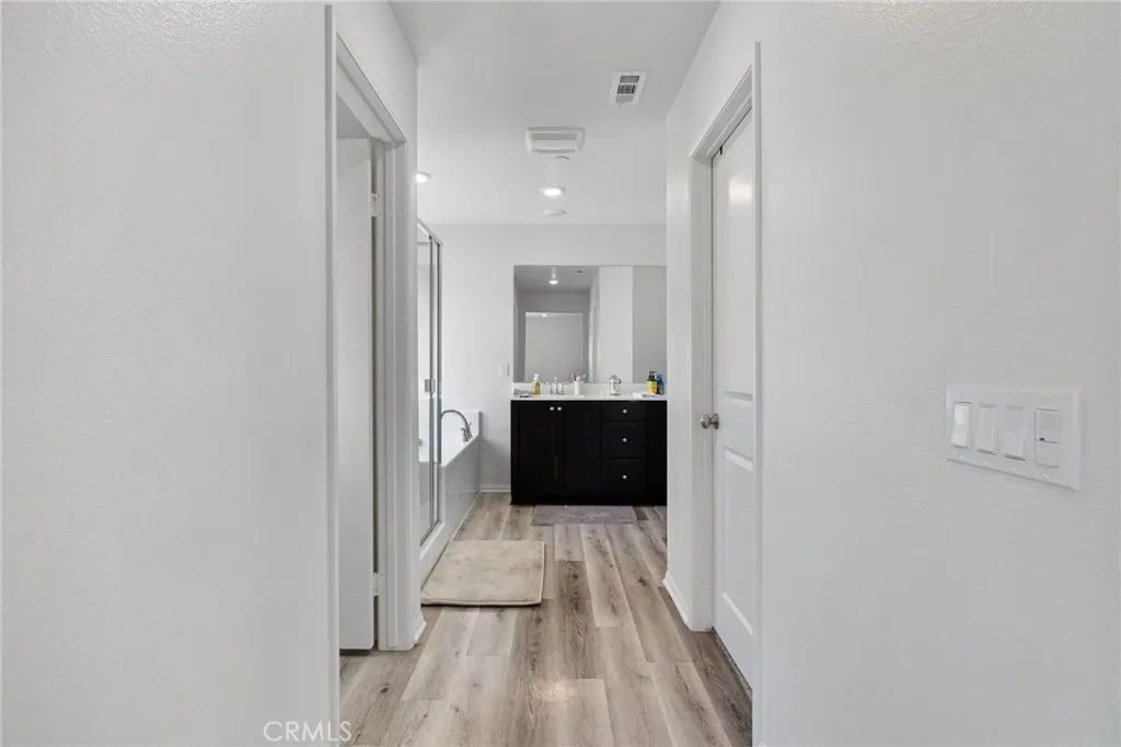 12487 Sunset Road Victorville, CA 92392 - Photo 30 of 44 a bathroom with a sink and a mirror