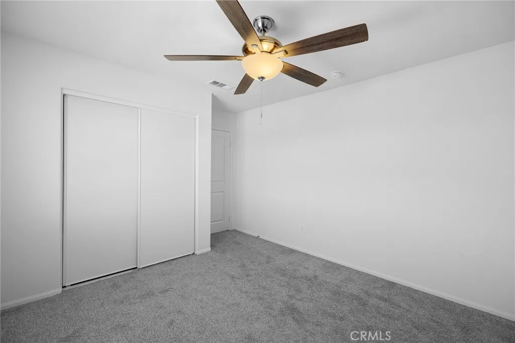 12487 Sunset Road Victorville, CA 92392 - Photo 37 of 44 an empty room with fan