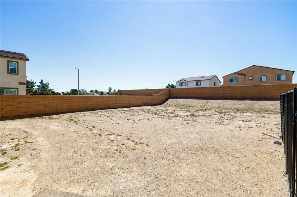 12487 Sunset Road Victorville, CA 92392 - Photo 43 of 44 a front view of a house with a yard