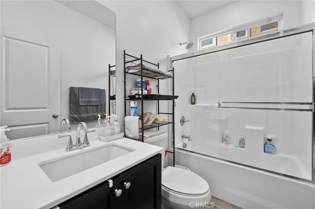 12487 Sunset Road Victorville, CA 92392 - Photo 9 of 44 a bathroom with a sink a toilet and shower