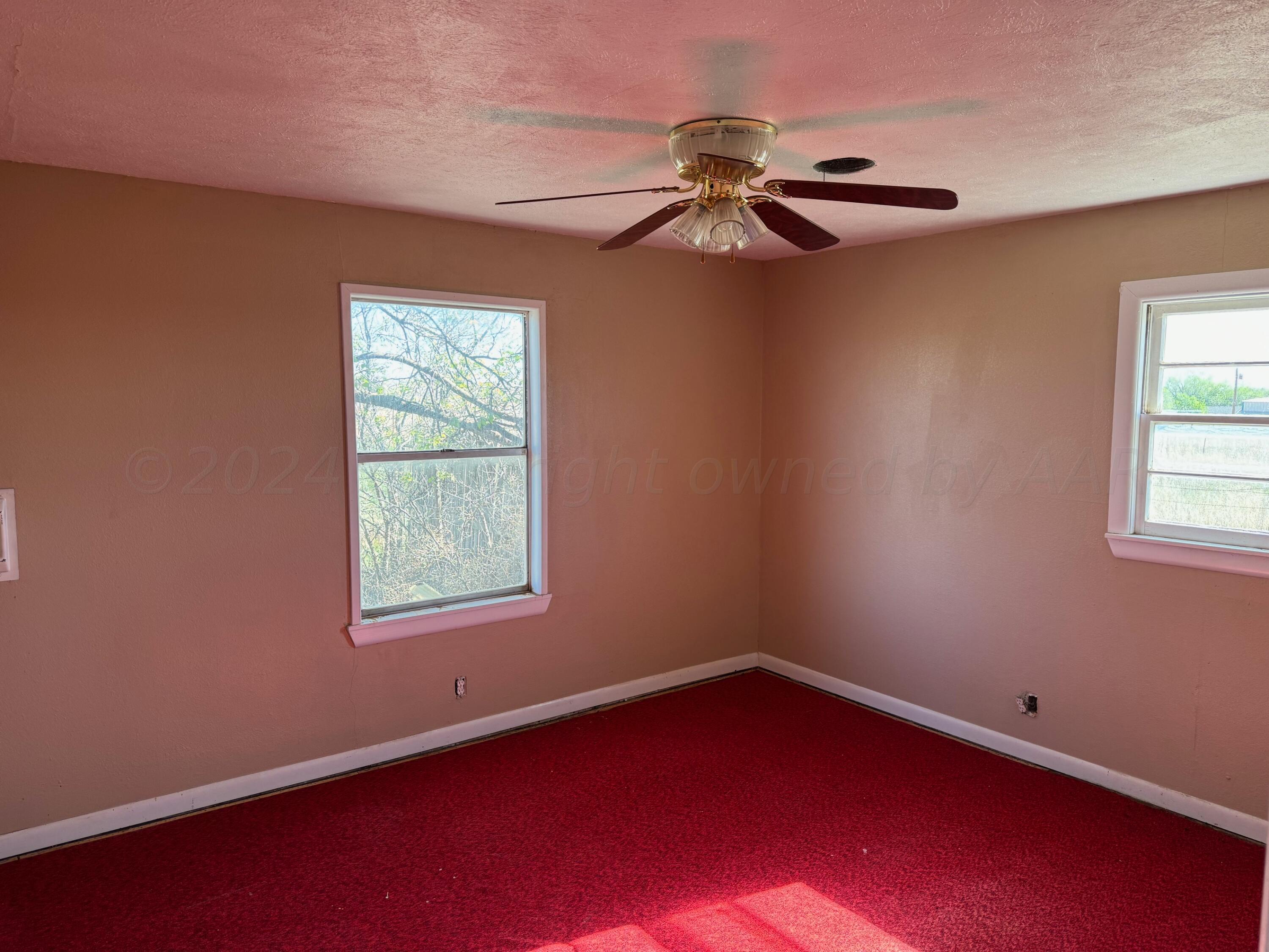 80 Chattanooga Road Amarillo, TX 79118 - Photo 11 of 33 an empty room with windows and fan