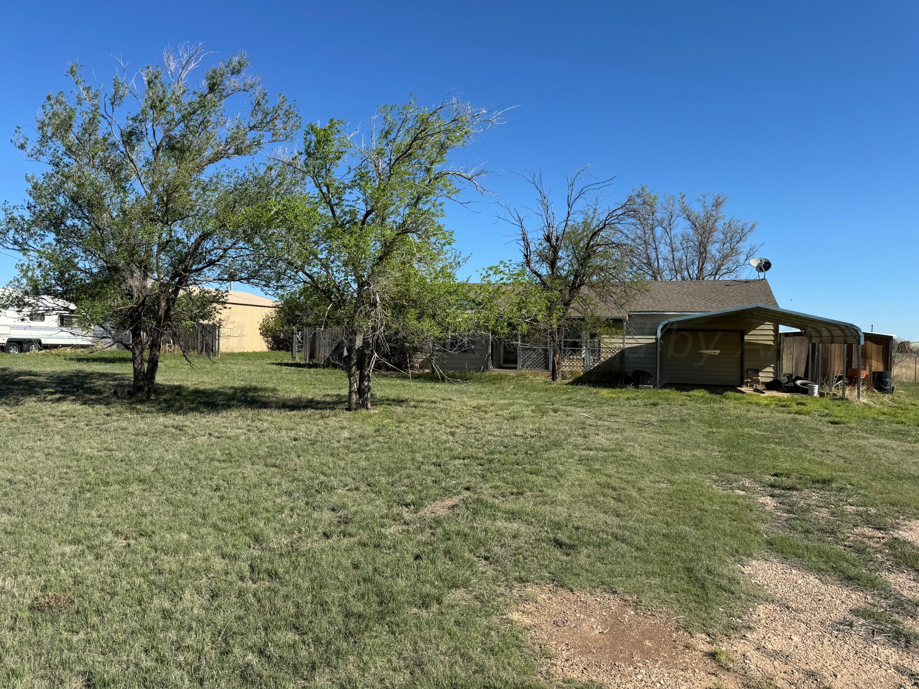 80 Chattanooga Road Amarillo, TX 79118 - Photo 2 of 33 a front view of a house with a garden