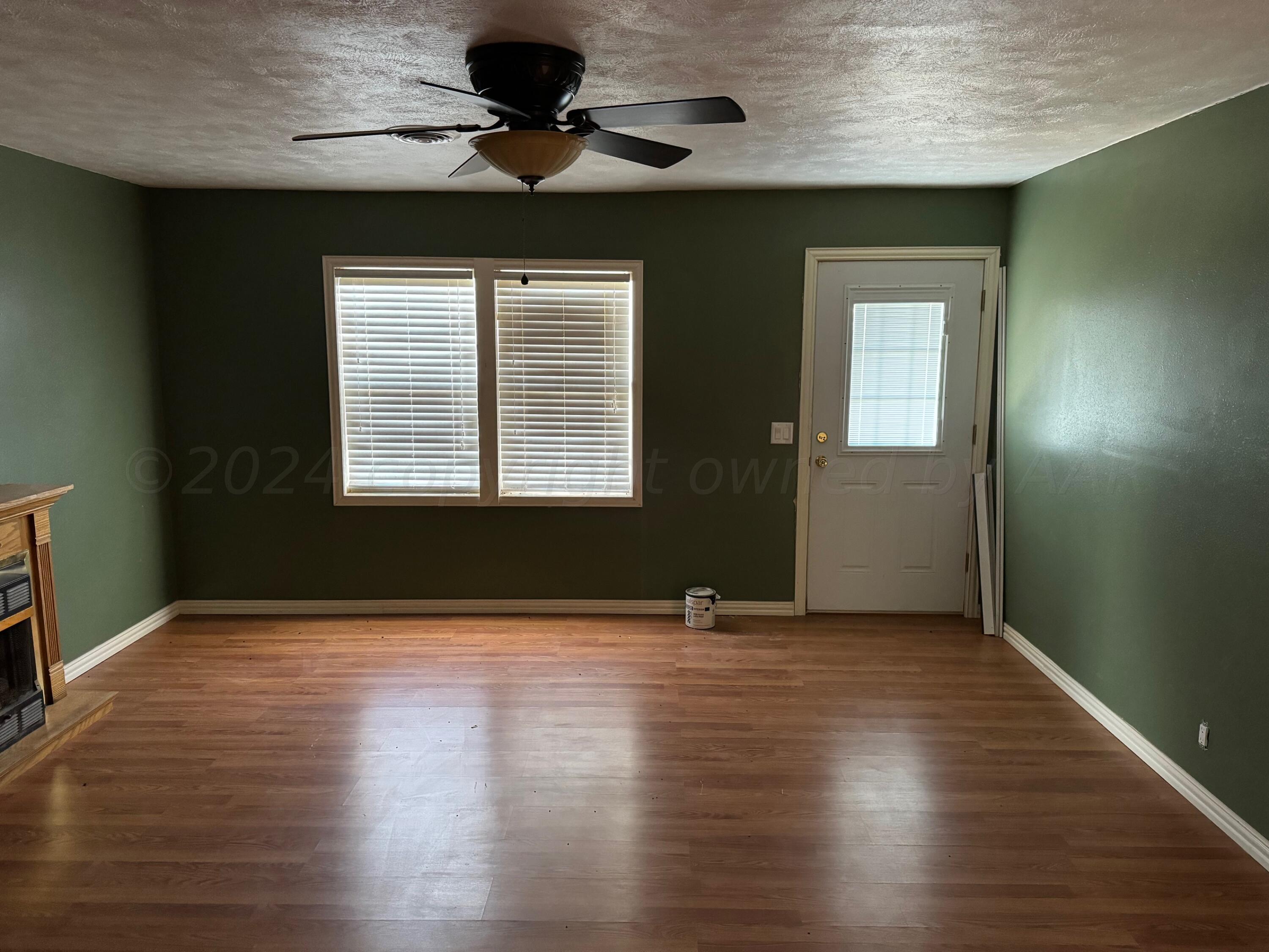 80 Chattanooga Road Amarillo, TX 79118 - Photo 5 of 33 a view of an empty room with wooden floor and a window