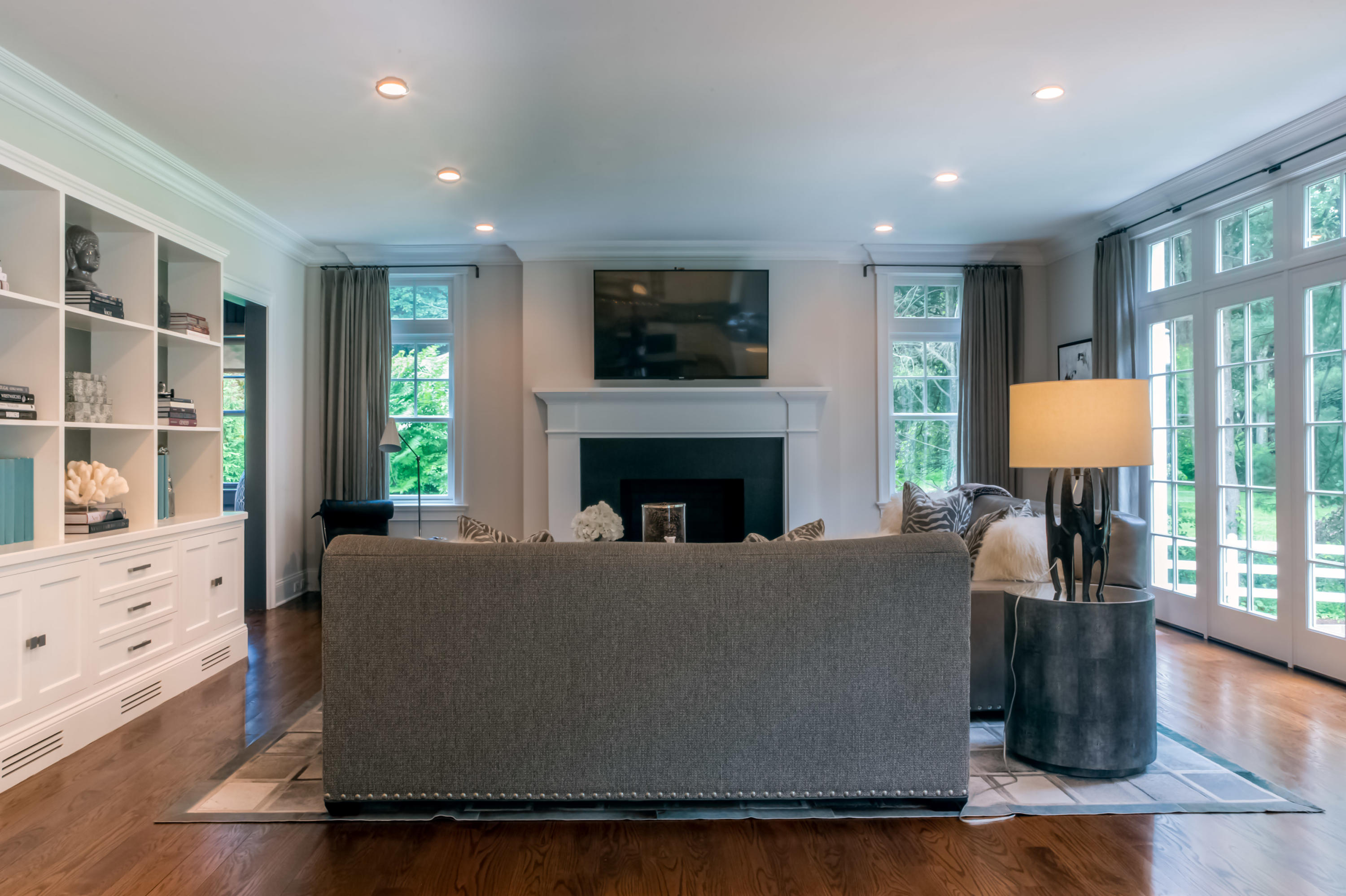 275 Middlesex Road Darien, CT 06820 - Photo 11 of 64 a living room with furniture a flat screen tv and a fireplace