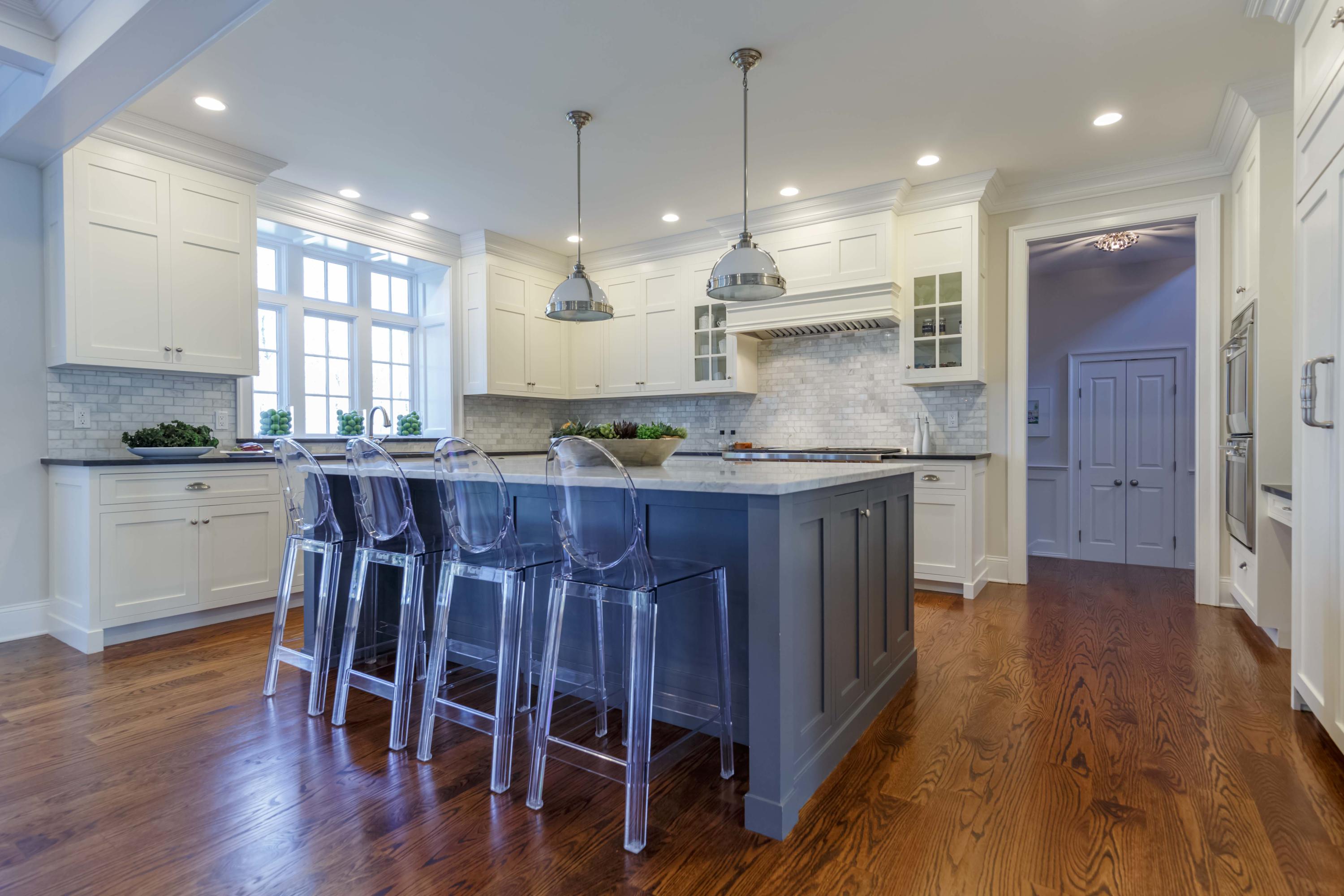 275 Middlesex Road Darien, CT 06820 - Photo 19 of 64 a kitchen with kitchen island granite countertop a sink a center island stainless steel appliances and cabinets