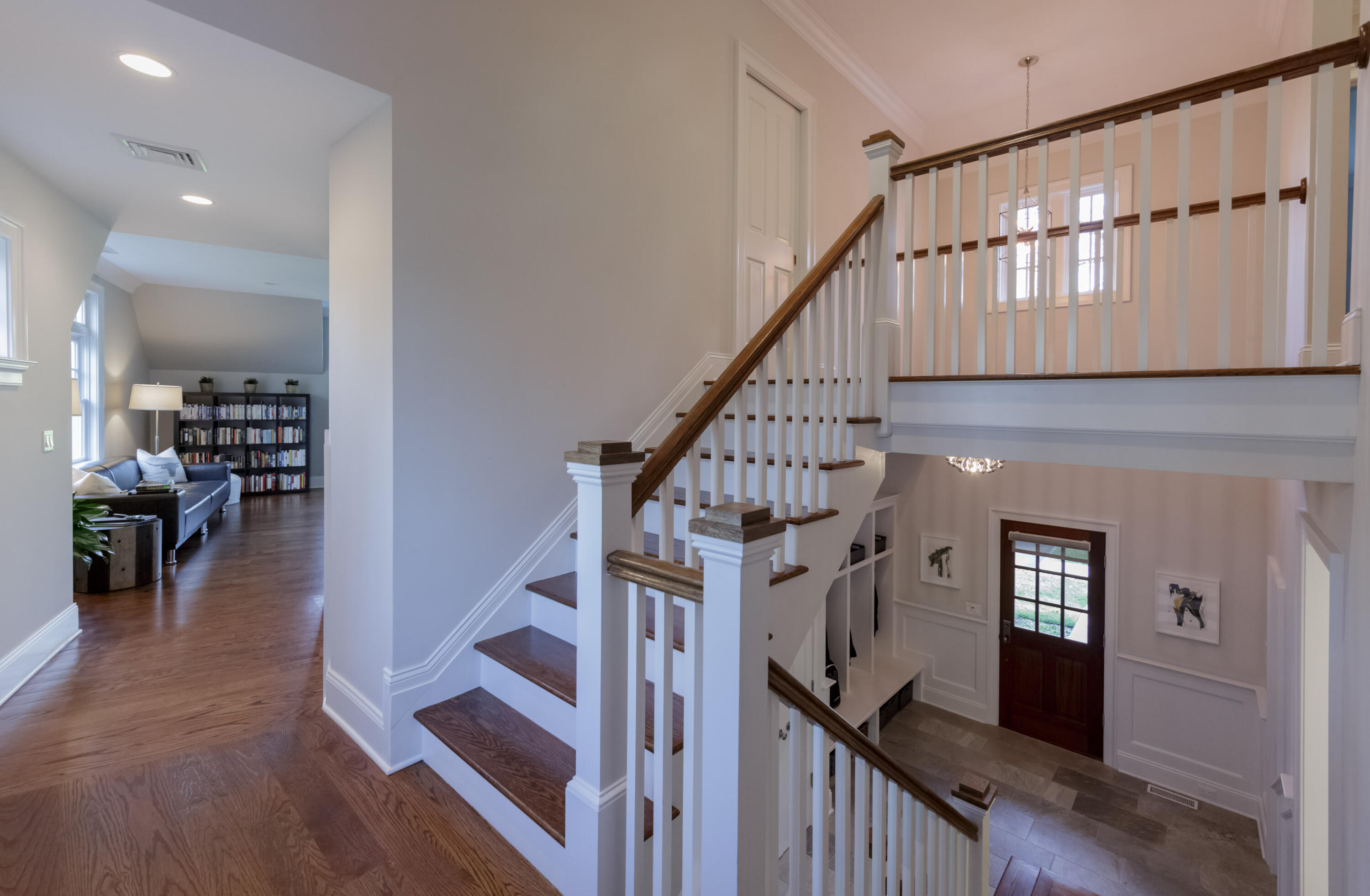 275 Middlesex Road Darien, CT 06820 - Photo 30 of 64 a view of staircase with lots of frames on wall and windows