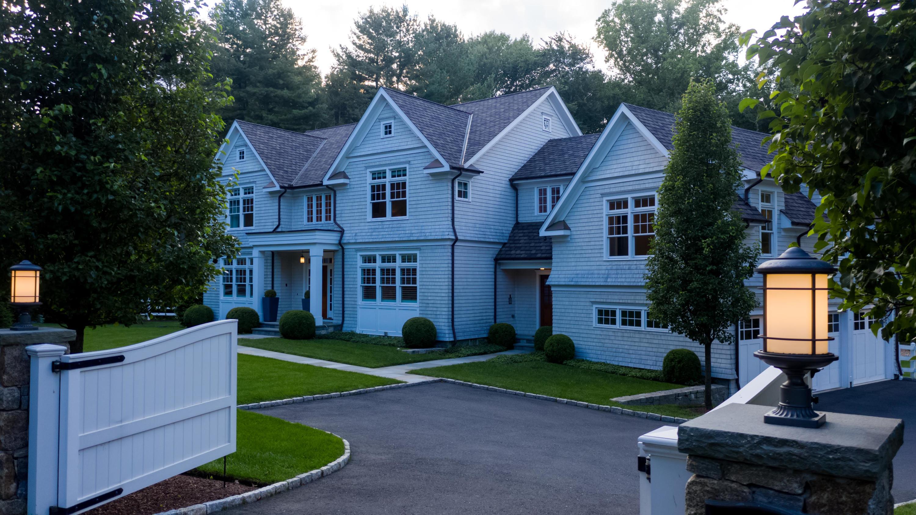 275 Middlesex Road Darien, CT 06820 - Photo 60 of 64 a front view of a house with a yard