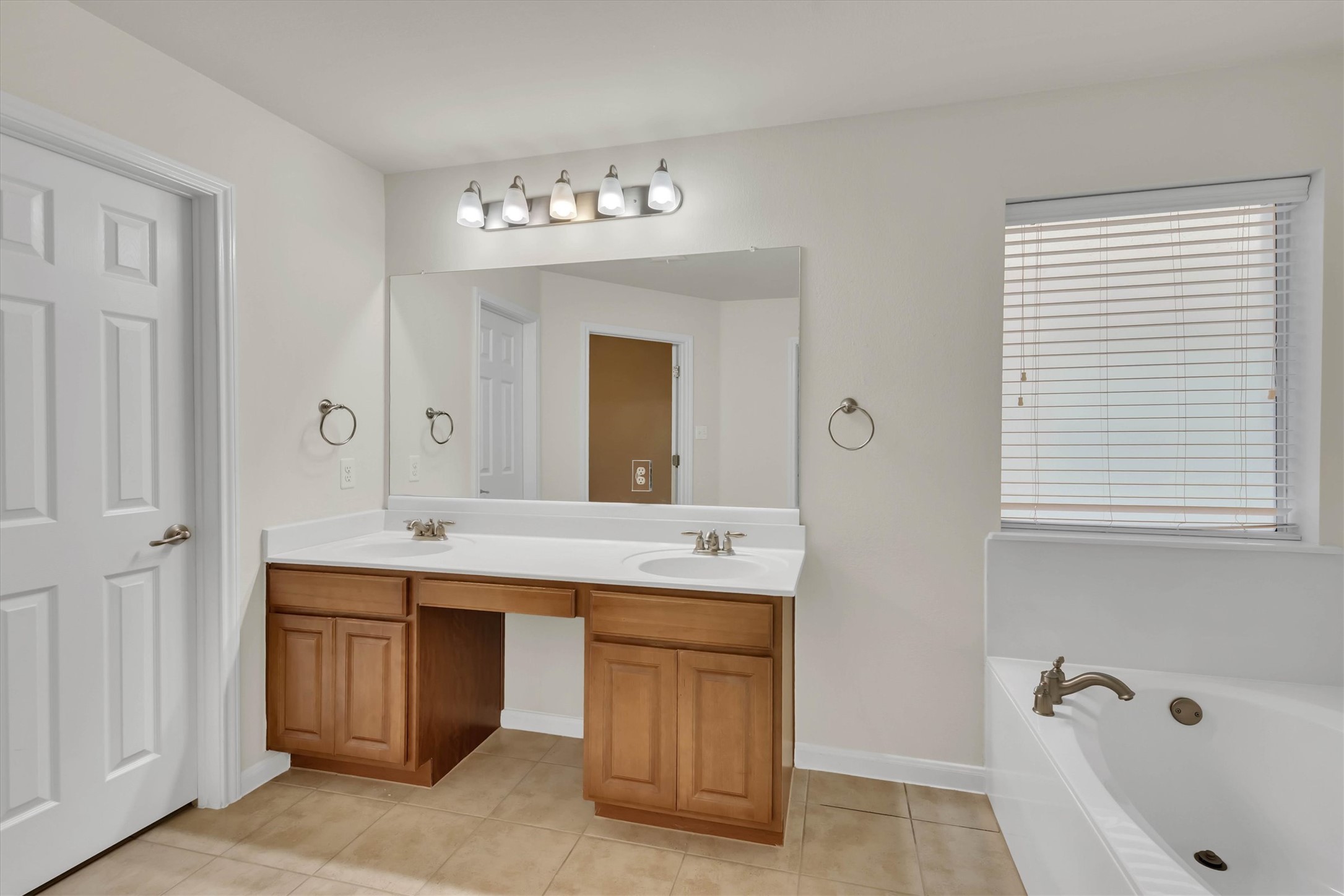 18420 Masi Loop Pflugerville, TX 78660 - Photo 20 of 33 Dual vanity with wood-finish cabinetry and integrated sinks