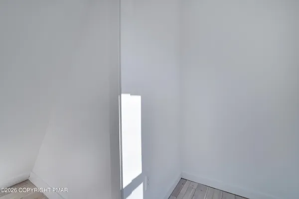 a bathroom with a toilet sink and shower