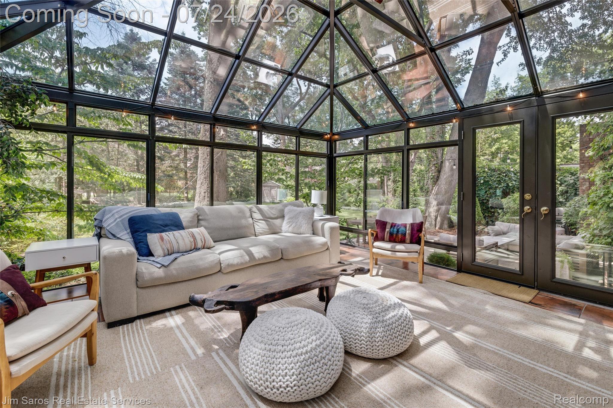 757 Middlesex Road Grosse Pointe, MI 48230 - Photo 15 of 45 Sun-drenched conservatory featuring a vaulted glass ceiling, expansive perimeter windows, and double glass French doors