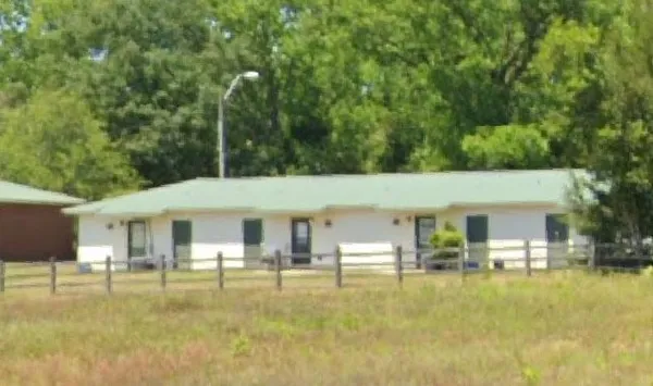a front view of a house with swimming pool