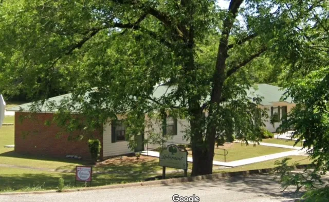 a view of a tree in front of a house
