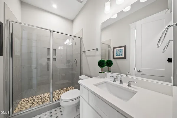 a bedroom with a bed couch and a window