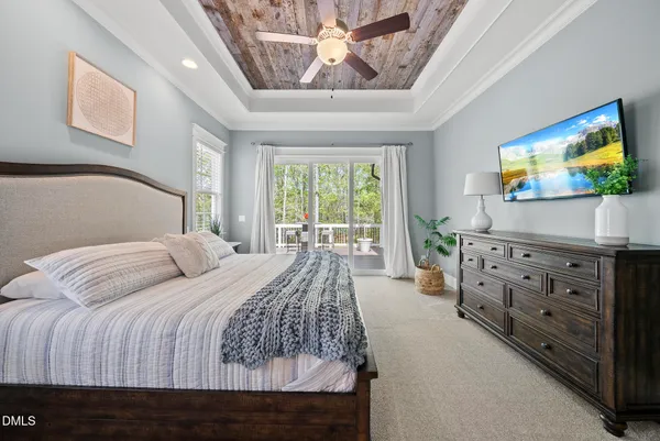 a spacious bedroom with a bed and a window