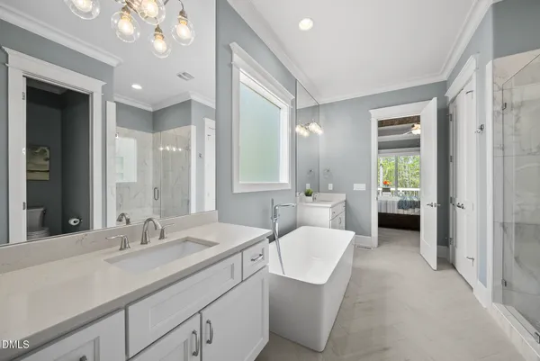 a view of walk in closet with clothes