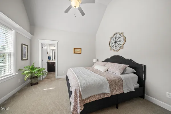 a bathroom with a sink vanity mirror and toilet