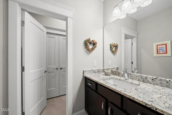 a living room with furniture a large window and a flat screen tv
