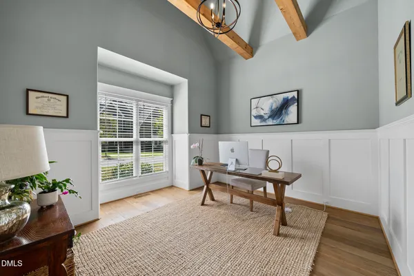 a view of a hallway view with wooden floor and furniture