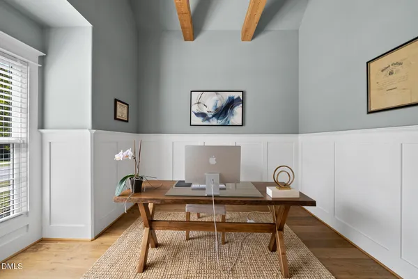 a workspace with furniture and a potted plant