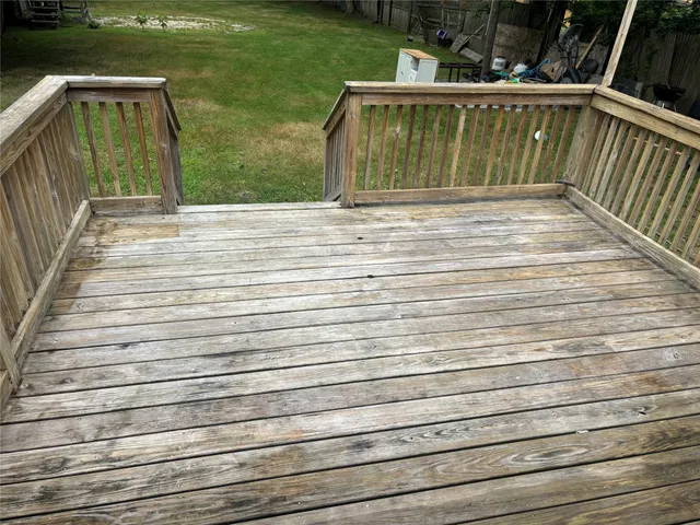 a view of a field with trees in the background