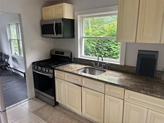 a view of kitchen with furniture and wooden floor