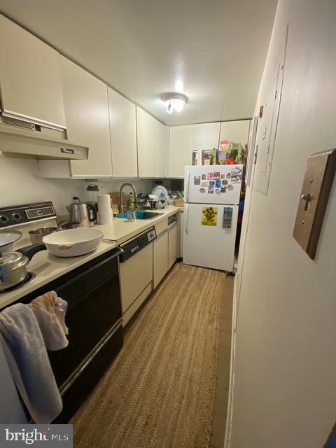 1825 T Street Northwest, Unit 201 Washington, DC 20009 - Photo 3 of 10 a kitchen with a sink appliances and cabinets