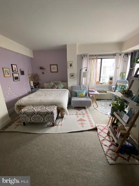 1825 T Street Northwest, Unit 201 Washington, DC 20009 - Photo 4 of 10 a living room with furniture and a large window