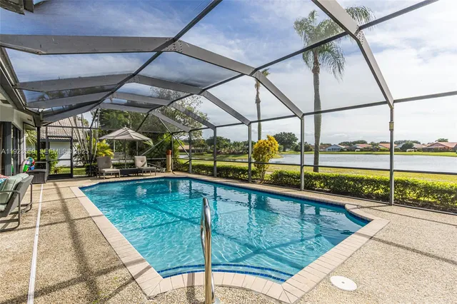 a view of a swimming pool with a porch
