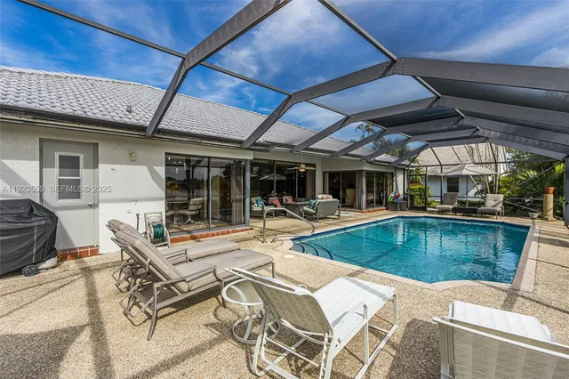 a view of a lake with houses in the background