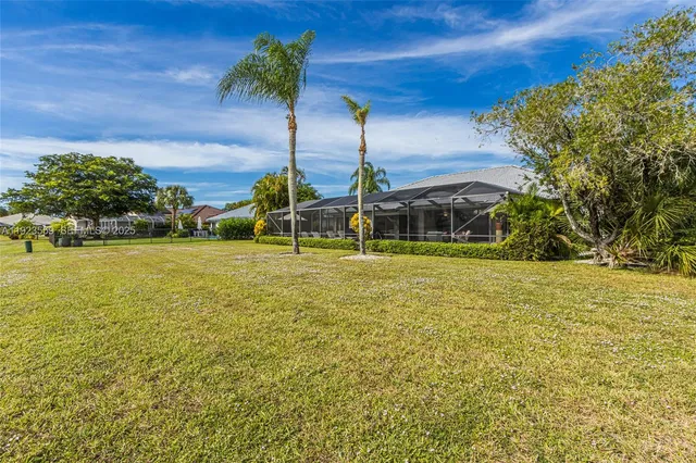 a view of a a dining room with furniture window and wooden floor