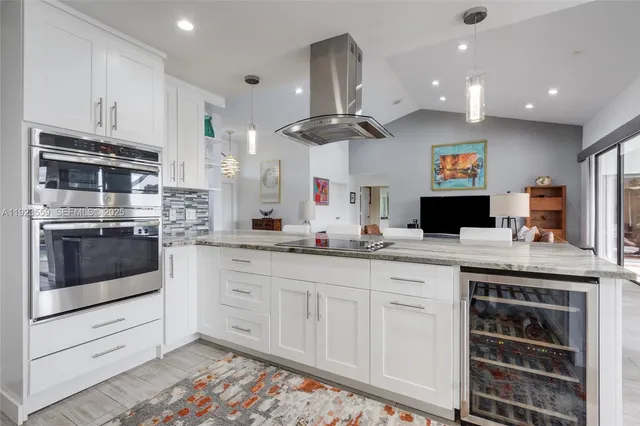 a spacious bathroom with a granite countertop sink mirror and shower