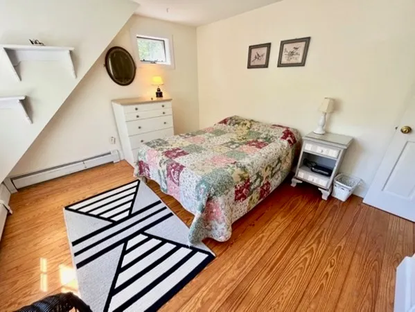 a bedroom with a bed and a cabinets