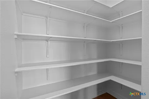 a view of an empty walk in closet