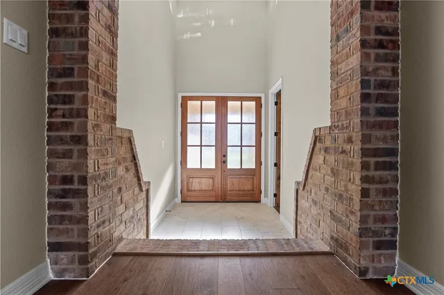 a view of entry way with wooden door