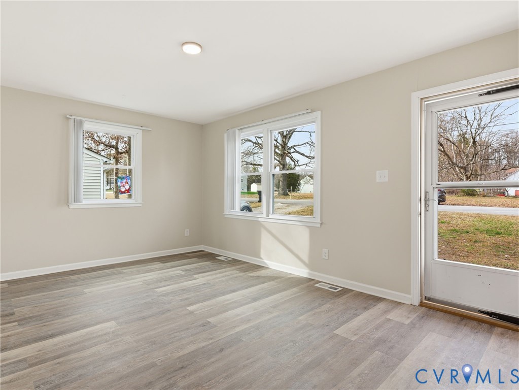 3626 Gilbert Street Hopewell, VA 23860 - Photo 4 of 20 a view of an empty room with window and wooden floor