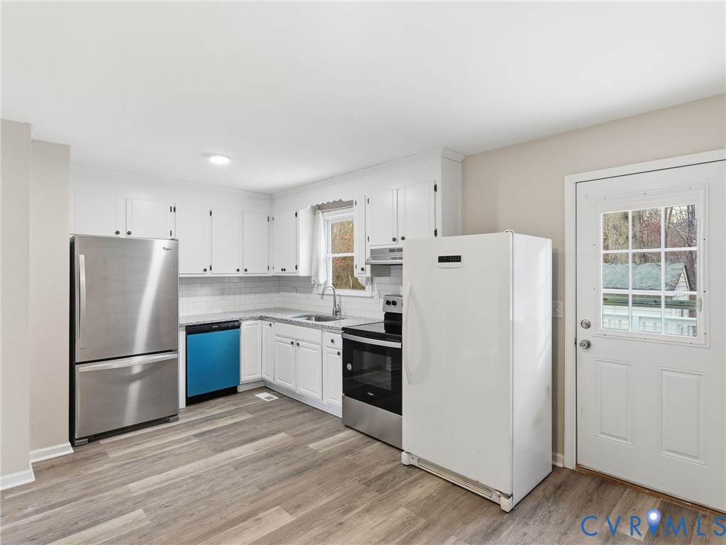 3626 Gilbert Street Hopewell, VA 23860 - Photo 5 of 20 a kitchen with stainless steel appliances a refrigerator sink and cabinets
