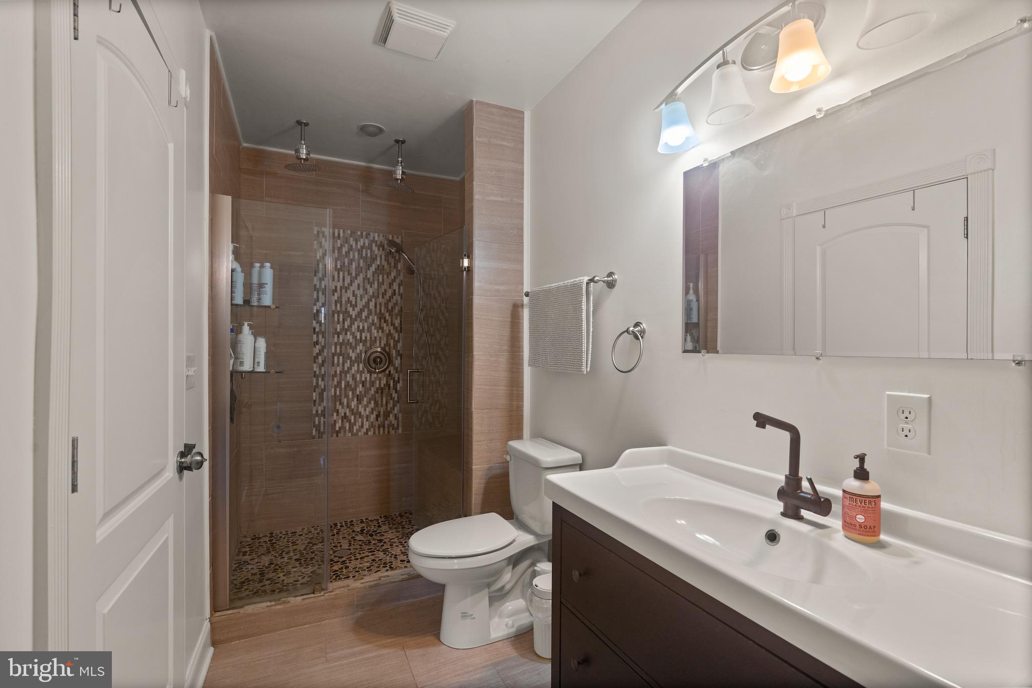 431 South Robinson Street Baltimore, MD 21224 - Photo 19 of 29 a bathroom with a sink a toilet and shower