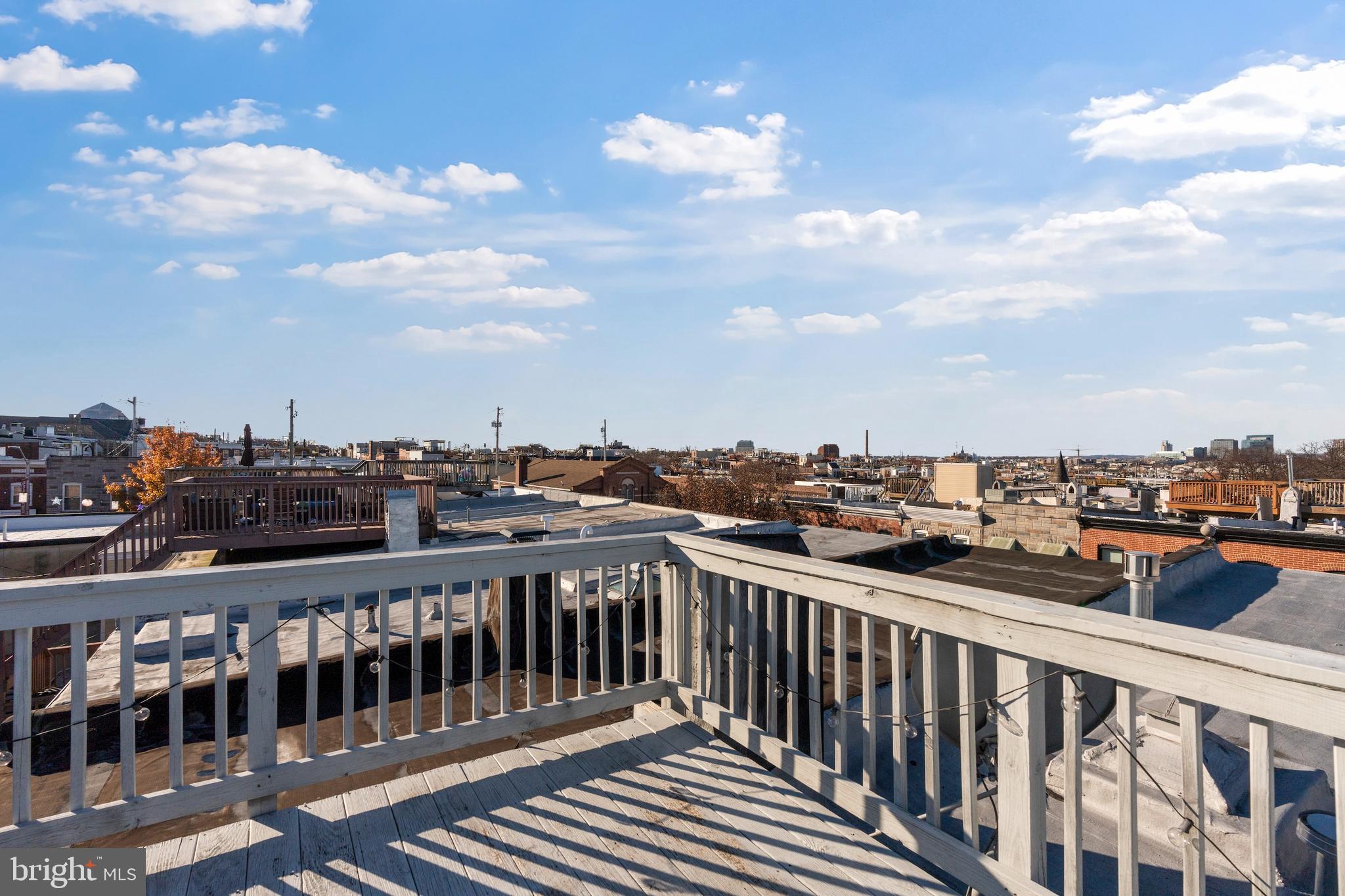 431 South Robinson Street Baltimore, MD 21224 - Photo 23 of 29 a view of a balcony with wooden fence