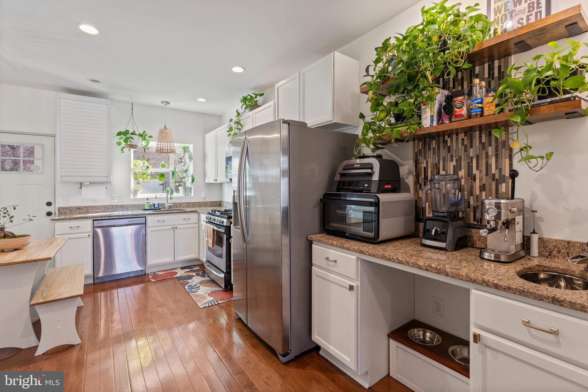 431 South Robinson Street Baltimore, MD 21224 - Photo 10 of 29 a kitchen with stainless steel appliances granite countertop a refrigerator and a stove top oven