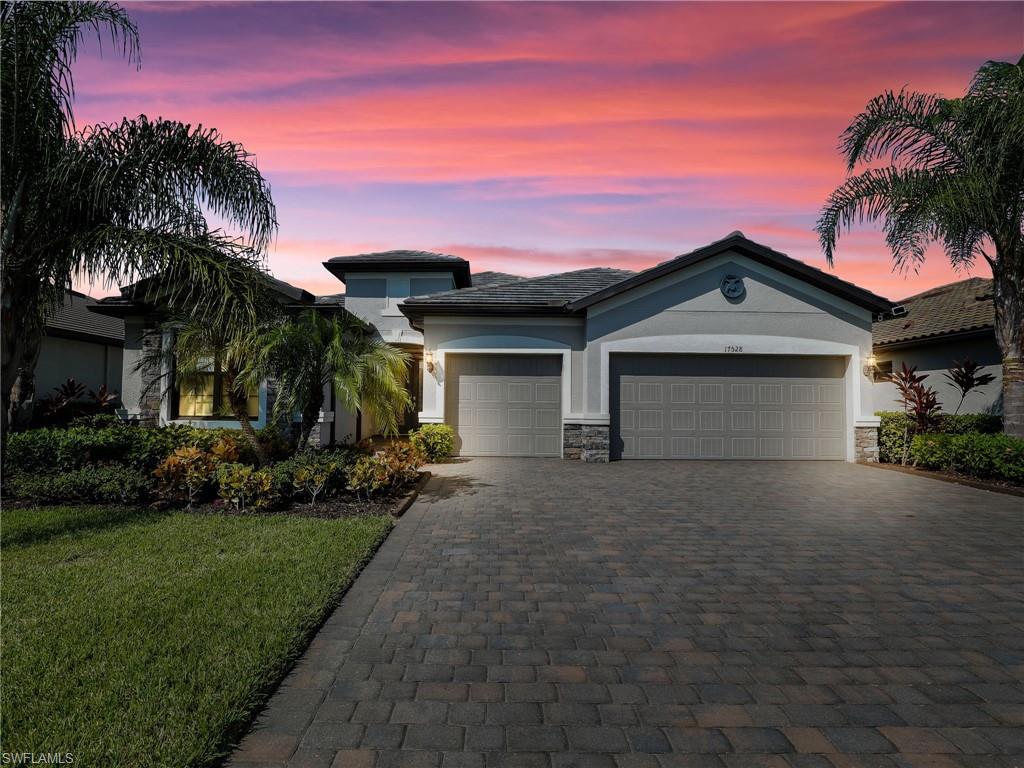 17528 Ashcomb Way Estero, FL 33928 - Photo 1 of 42 front view of house with a yard
