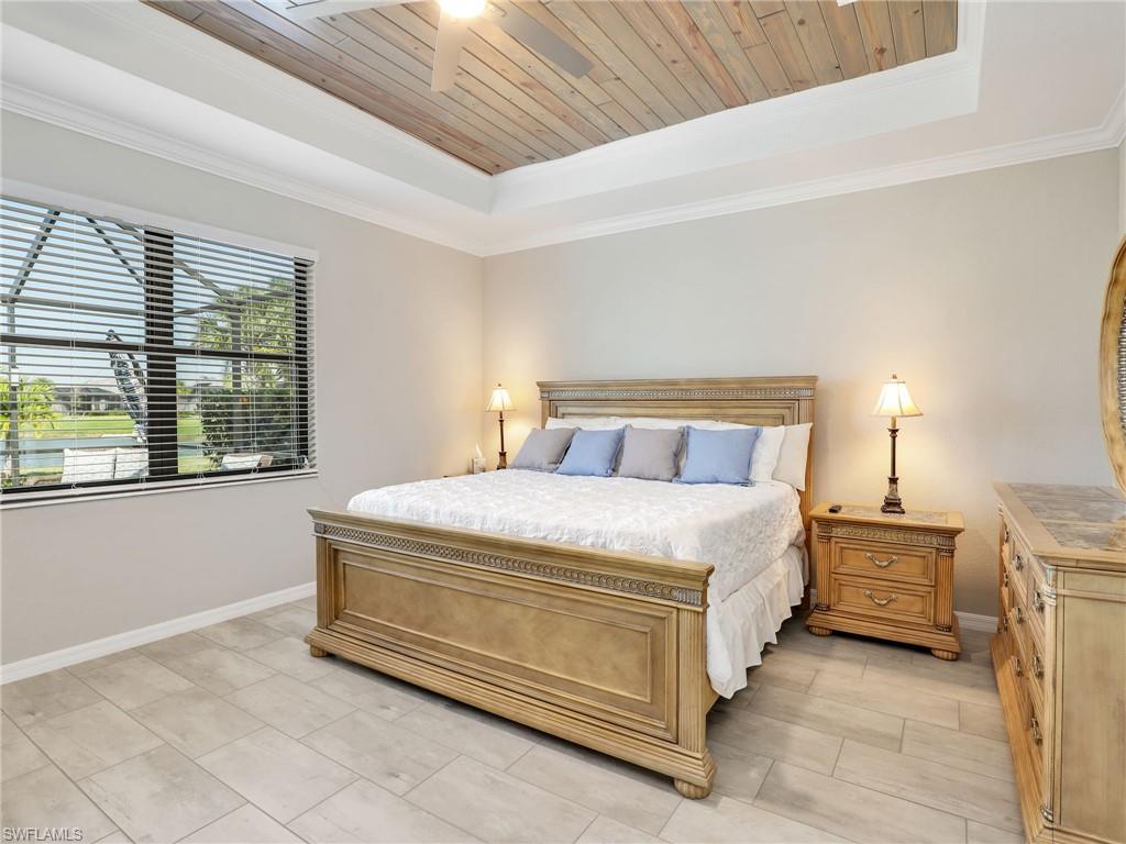 17528 Ashcomb Way Estero, FL 33928 - Photo 12 of 42 a bedroom with a bed and a cabinets