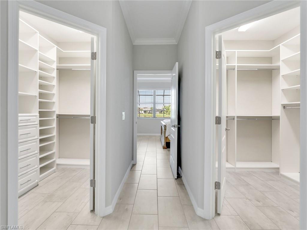 17528 Ashcomb Way Estero, FL 33928 - Photo 17 of 42 a view of a hallway with wooden shelves