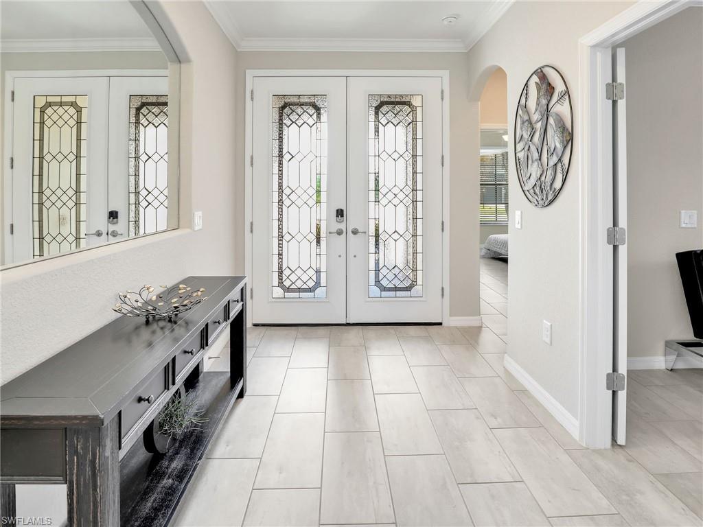 17528 Ashcomb Way Estero, FL 33928 - Photo 2 of 42 a view of an entryway with a livingroom