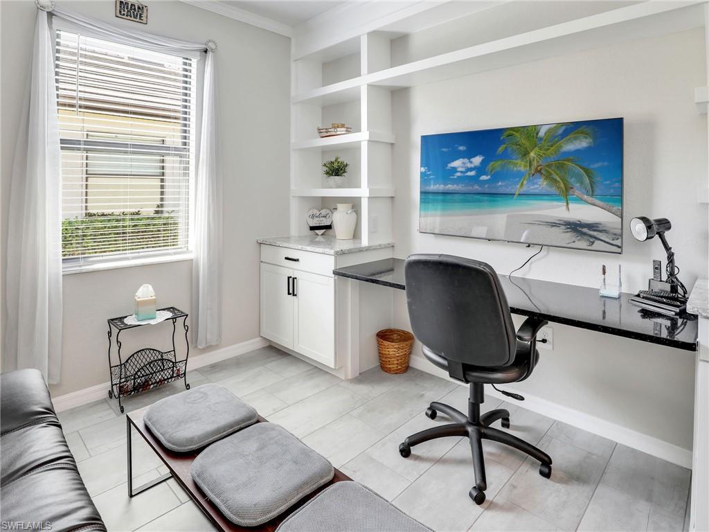 17528 Ashcomb Way Estero, FL 33928 - Photo 24 of 42 a view of a workspace with furniture and a window