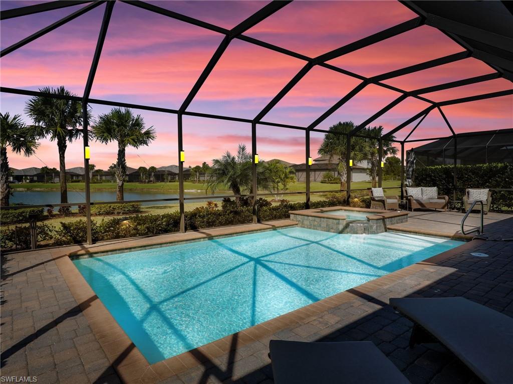 17528 Ashcomb Way Estero, FL 33928 - Photo 25 of 42 a view of a backyard with sitting area