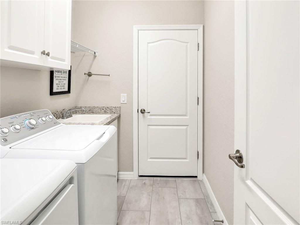 17528 Ashcomb Way Estero, FL 33928 - Photo 29 of 42 a utility room with dryer and washer