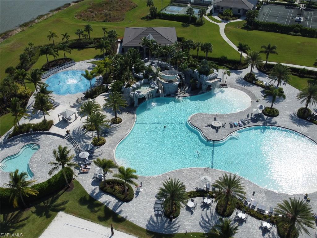 17528 Ashcomb Way Estero, FL 33928 - Photo 32 of 42 a view of a swimming pool with a yard