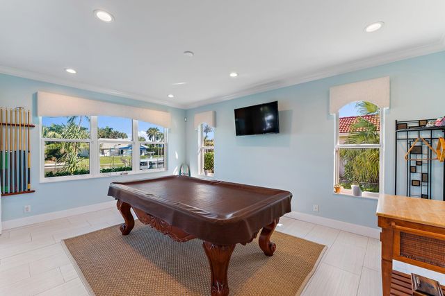 a bedroom with a bed couch and a window