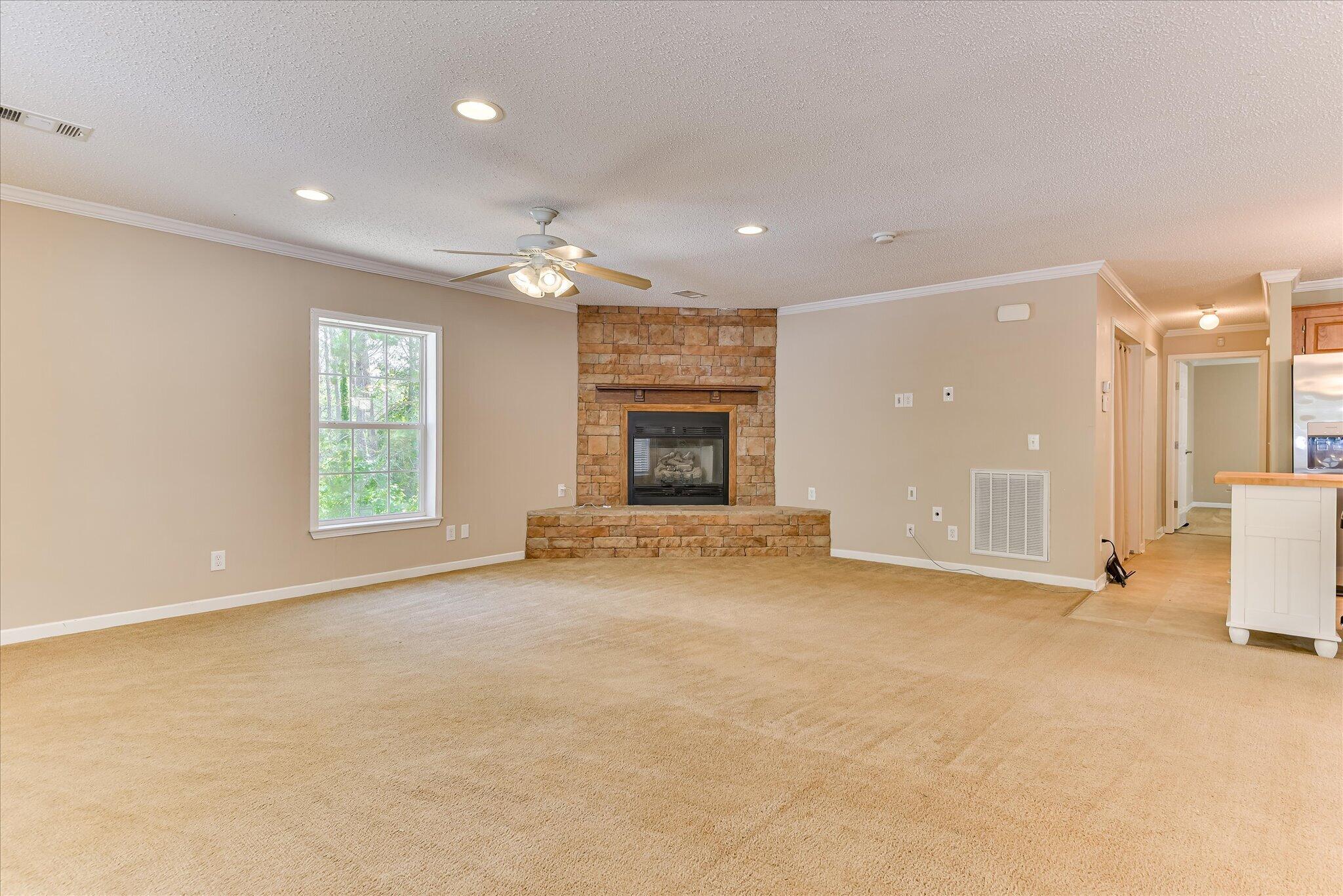 1405 Garrett Road Clarks Hill, SC 29821 - Photo 9 of 51 an empty room with windows and fireplace