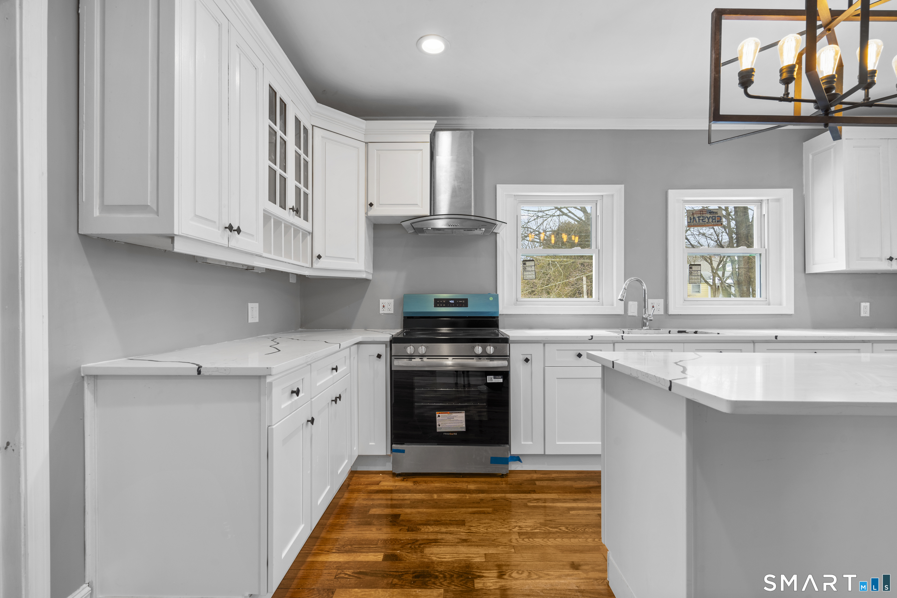171 Foster Street Meriden, CT 06451 - Photo 15 of 35 a kitchen with stainless steel appliances granite countertop a stove and a sink